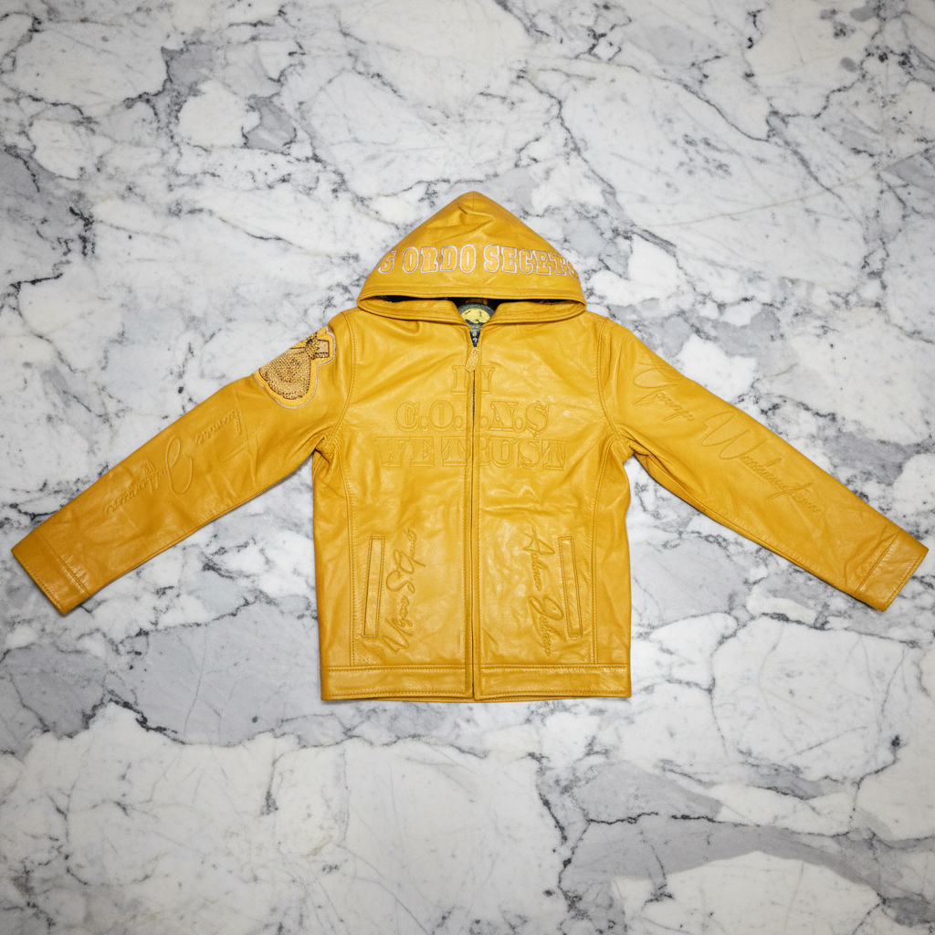 A yellow leather hooded jacket with a front zipper, laid flat on a white background. The hood features 'GABRIEL' embroidered in light lettering, and there is a circular patch on the left sleeve.