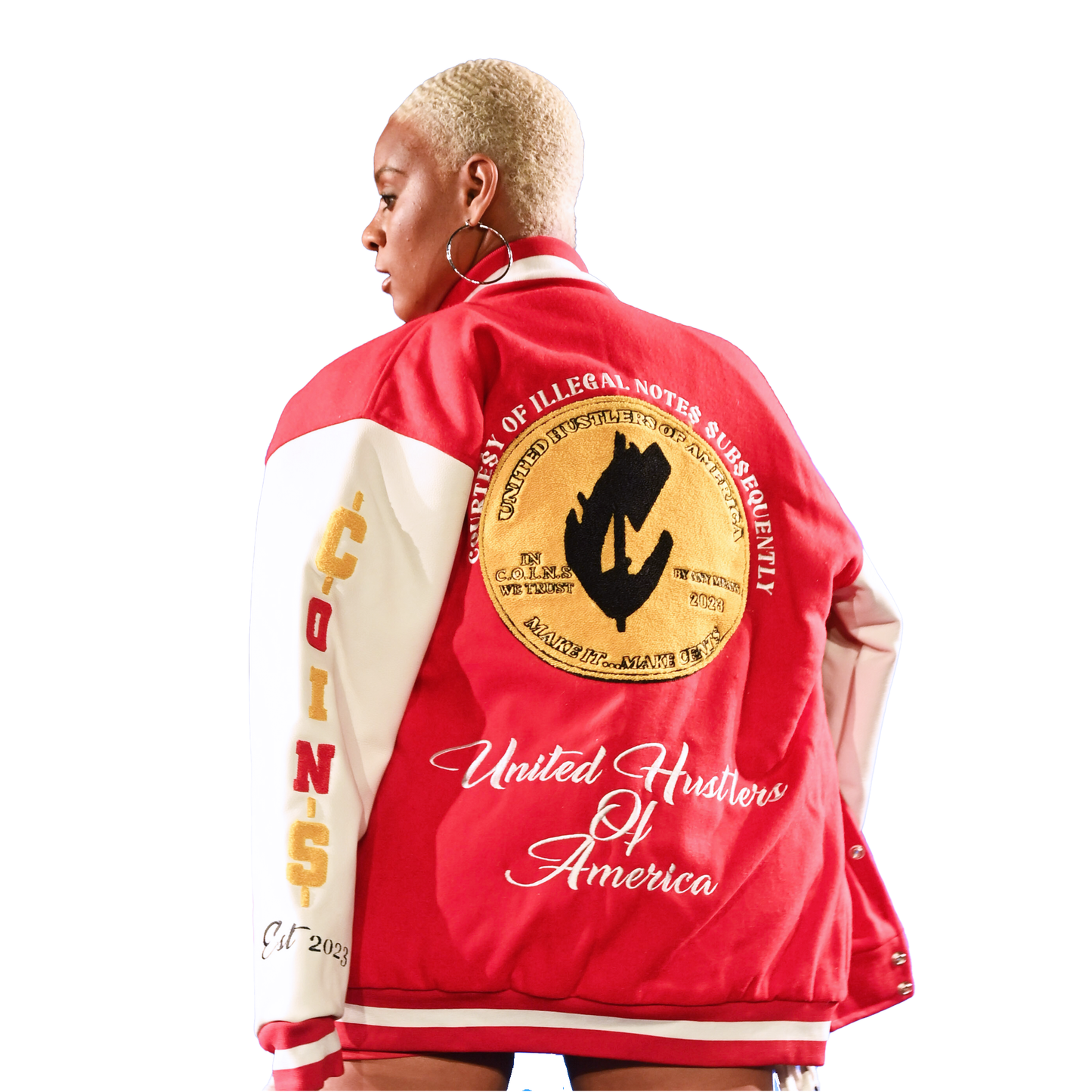 Person wearing a red and beige jacket with text and graphics on the back