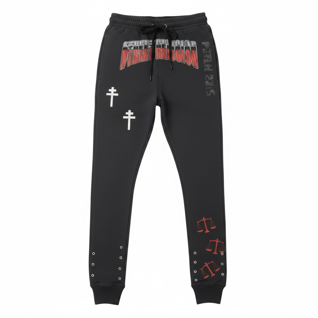 Black jogger pants with red and white designs on a white background
