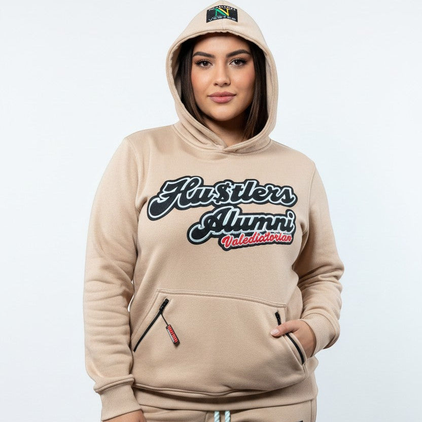 NUMMI VESTES beige premium cotton hooded sweatsuit with Hustlers Alumni graphic and zippered pockets on a model