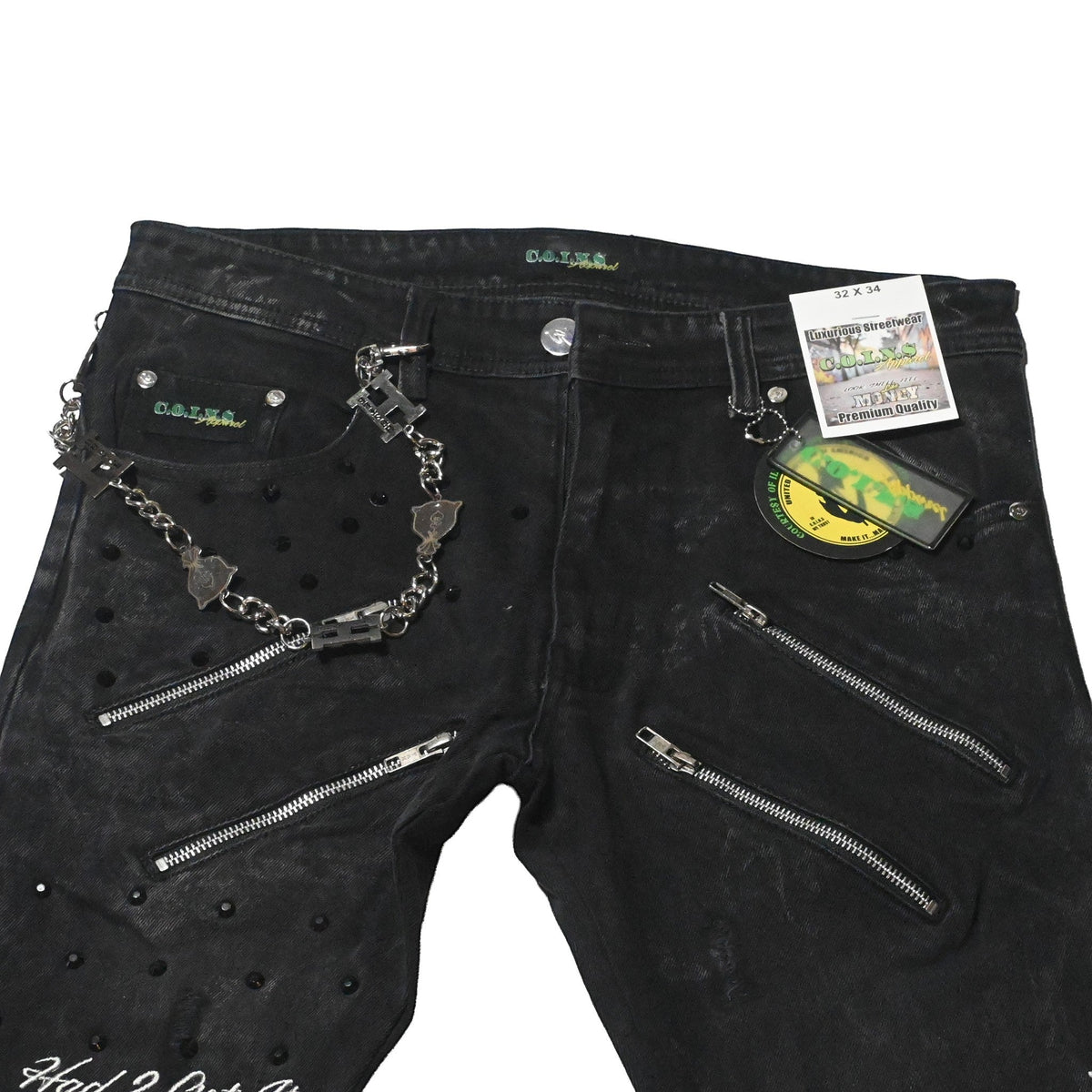 NUMMI VESTES black acid washed denim jeans with dual thigh zippers, rhinestone studs, and decorative metal chains.