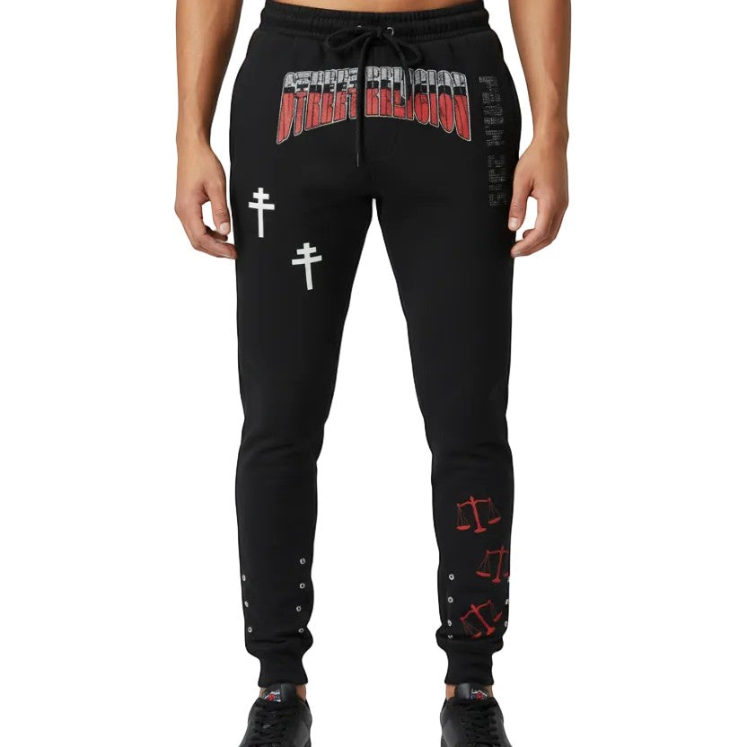 NUMMI VESTES black cotton joggers featuring Street Religion graphic, white cross prints, and red scale icons.