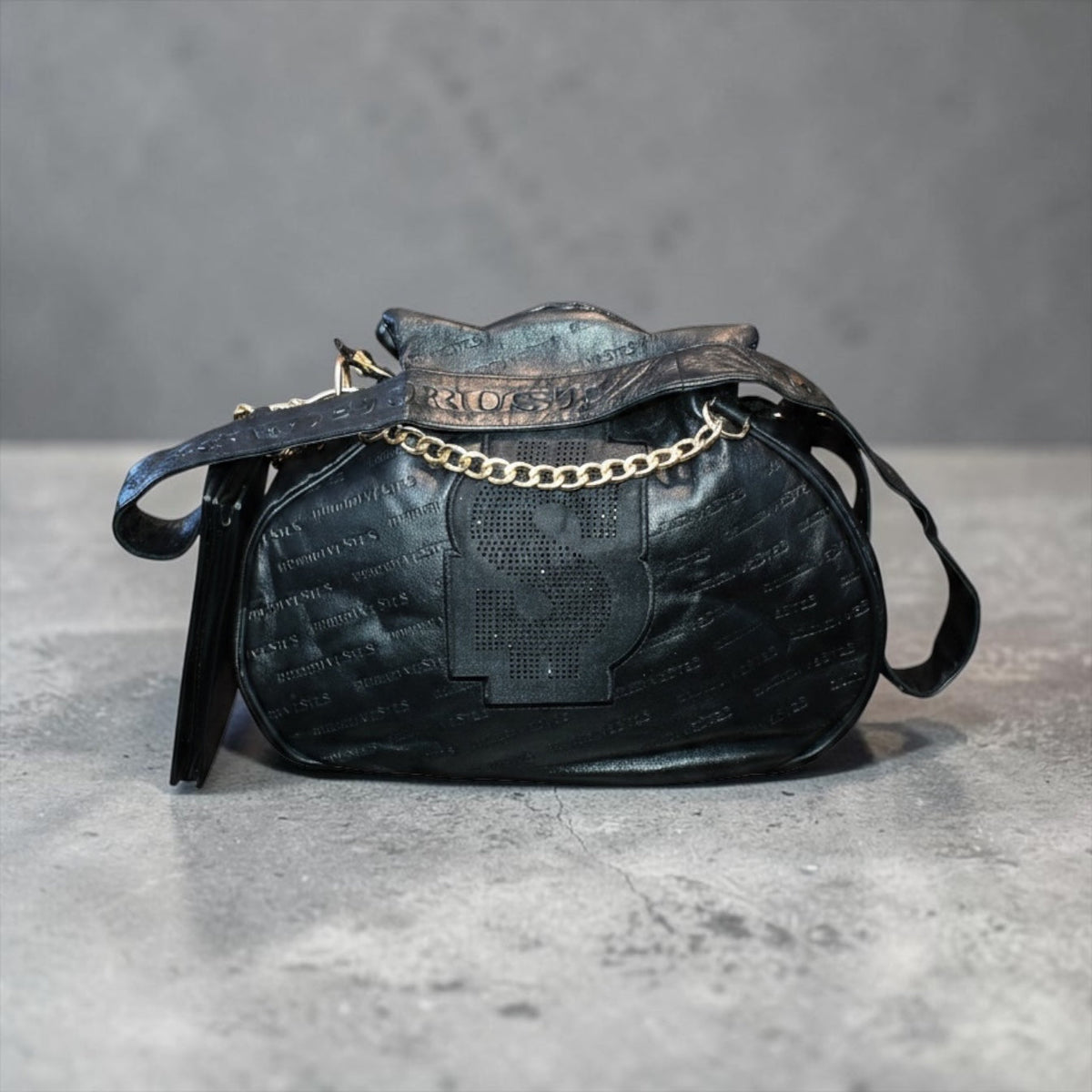 NUMMI VESTES black embossed leather shoulder bag with crystal dollar sign logo, gold chain detail, and attached wallet.