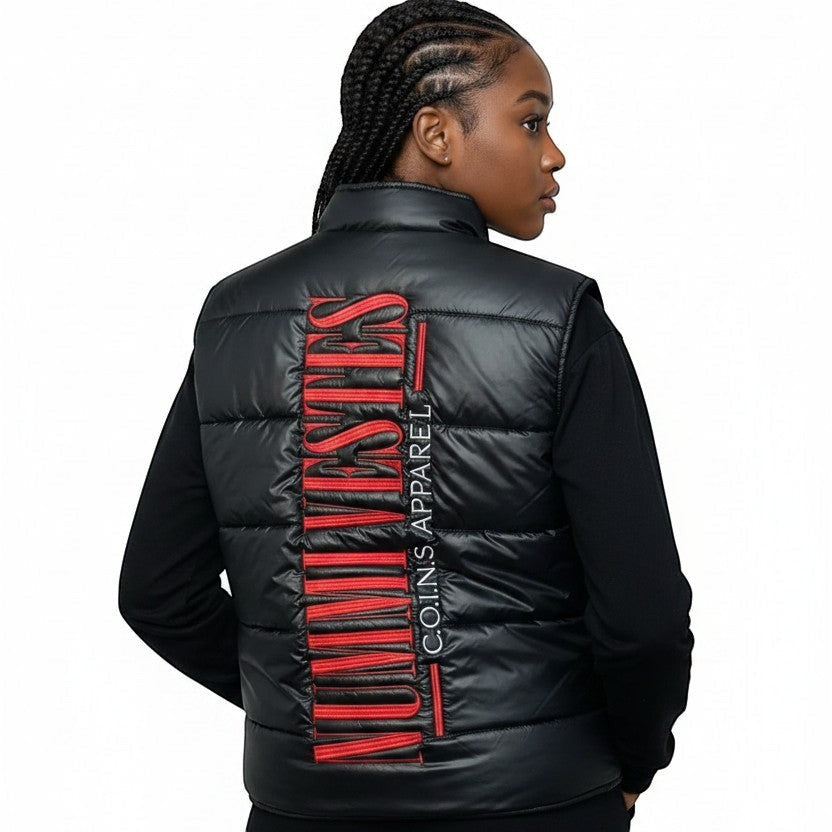 Model wearing a NUMMI VESTES black puffer vest with a large vertical red graphic on the back, rear view.