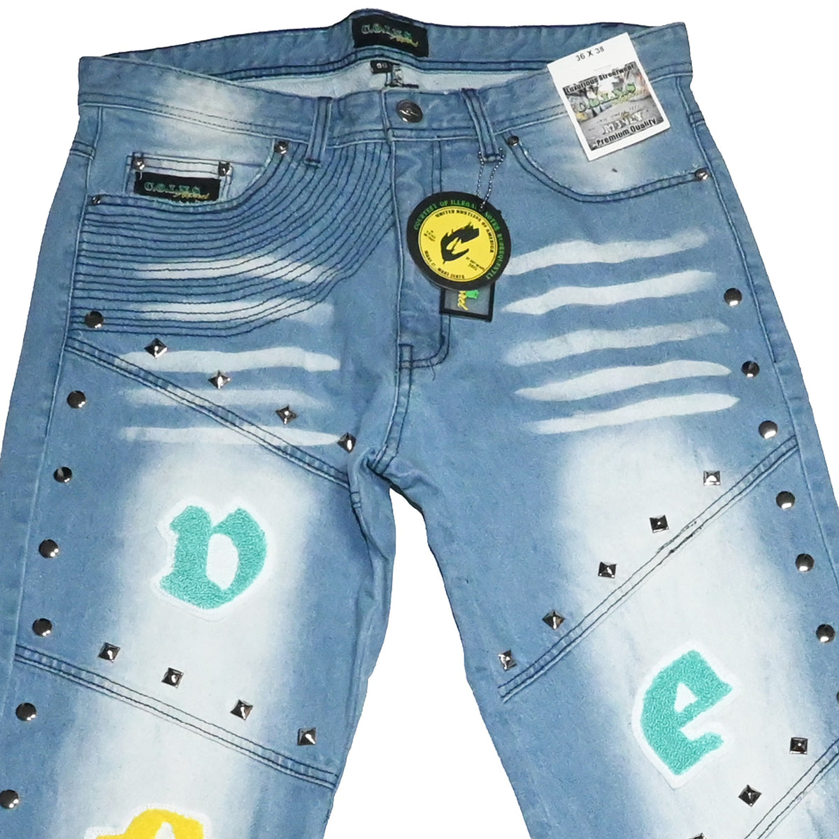 NUMMI VESTES light blue boyfriend jeans with silver studs, chenille lettering, and embroidered side leg detail.