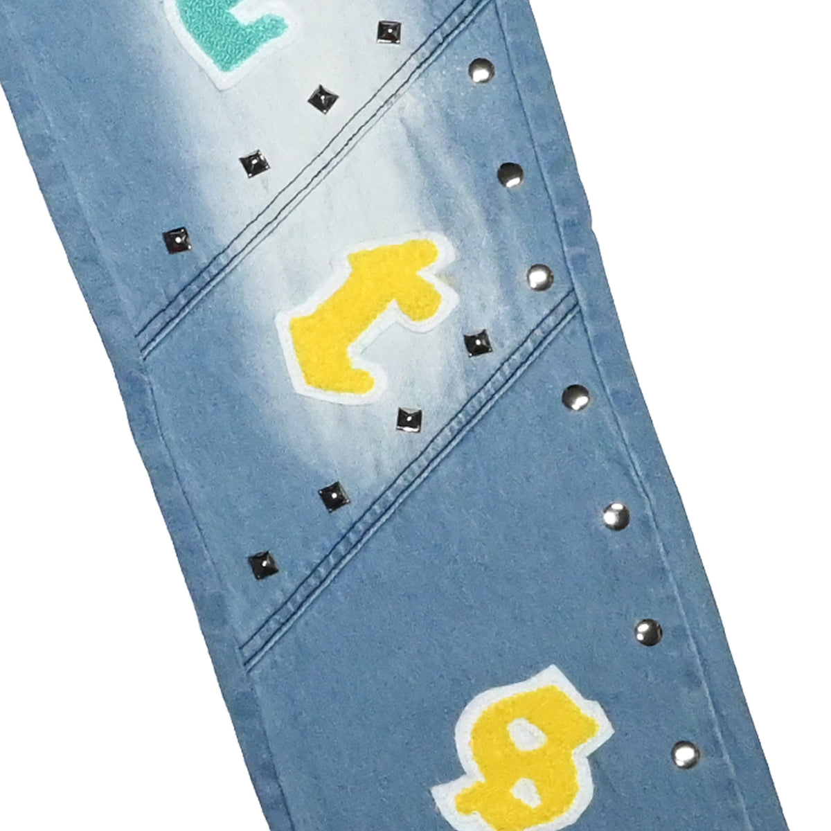 NUMMI VESTES light blue denim boyfriend jeans with silver stud hem details and colorful chenille letter patches.