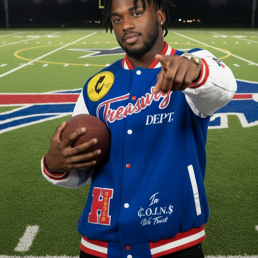 NUMMI VESTES Treasury Dept. blue wool varsity jacket with white leather sleeves, worn by a man on a football field.