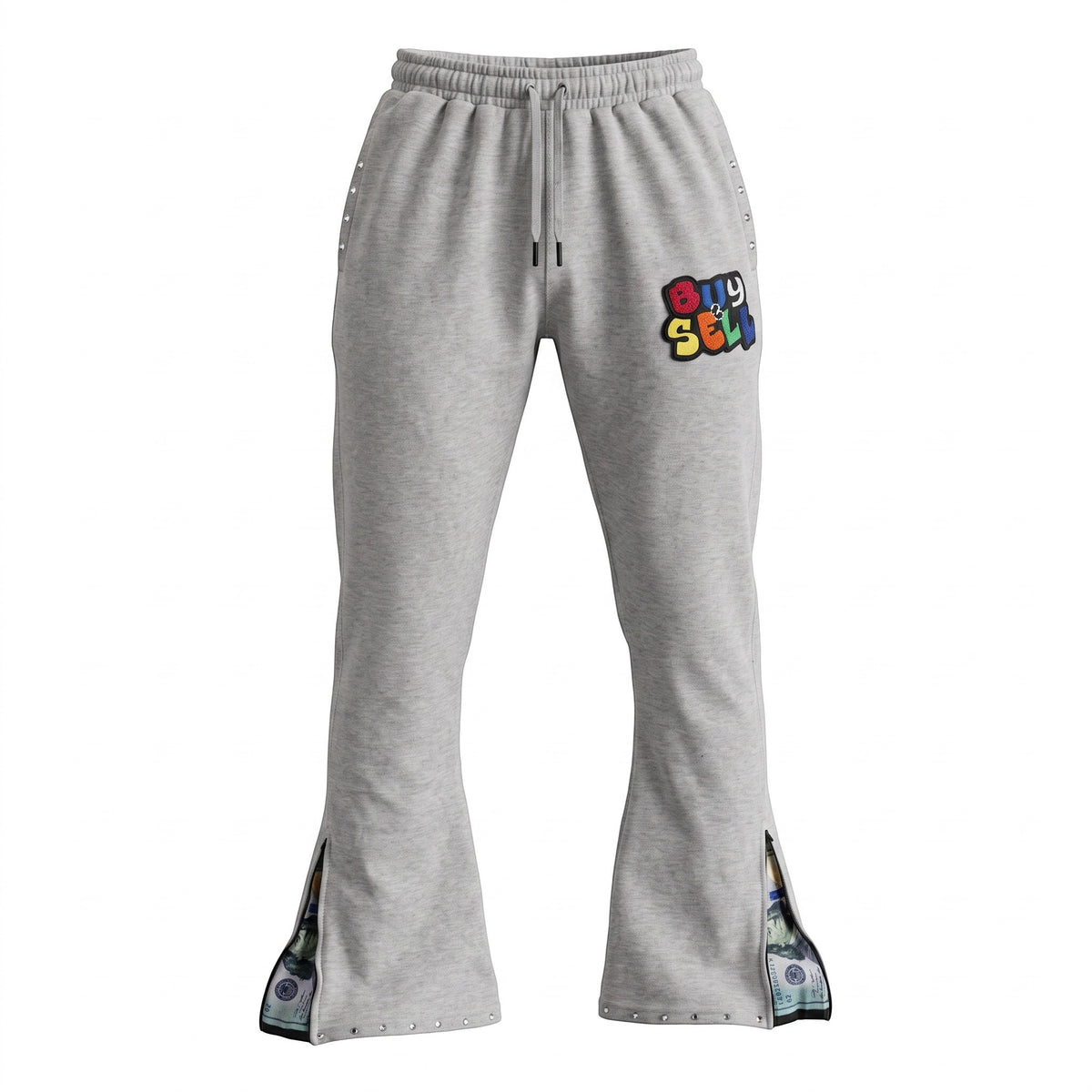 NUMMI VESTES light gray terry cotton flared joggers with Buy & Sell chenille patch, rhinestone studs, and leg zips.