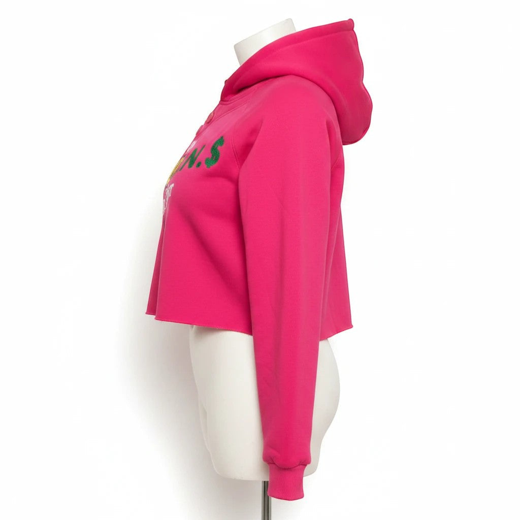 NUMMI VESTES hot pink cropped pullover hoodie with graphic embroidery and button neckline, side view on mannequin