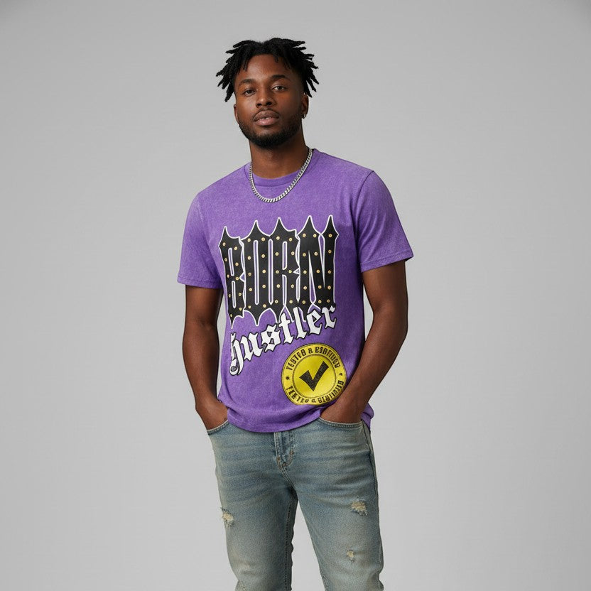 NUMMI VESTES purple acid-wash graphic t-shirt with Born Hustler print worn by a man with distressed denim jeans