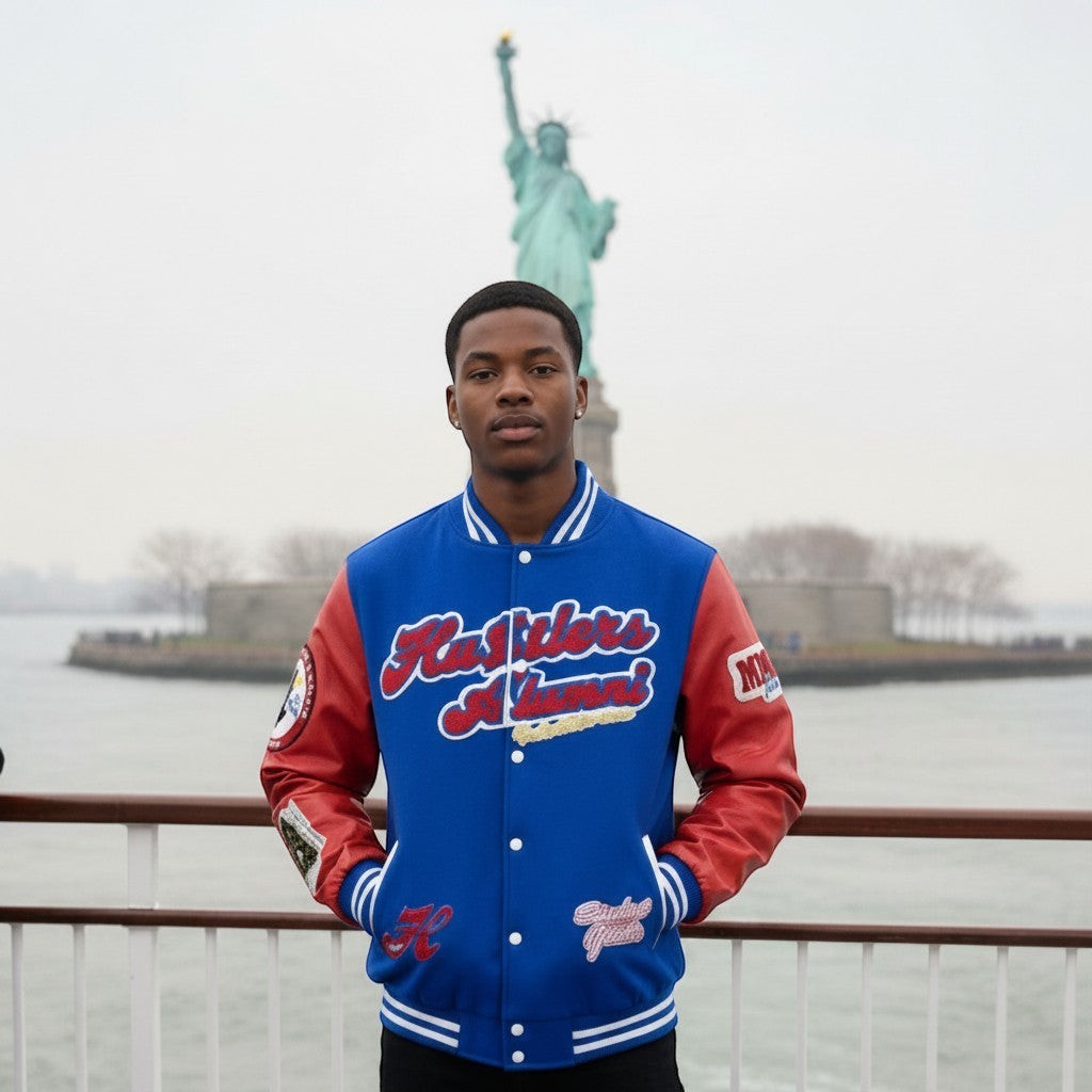 NUMMI VESTES royal blue and red wool-blend varsity bomber jacket with embroidered patches worn by a man in NYC